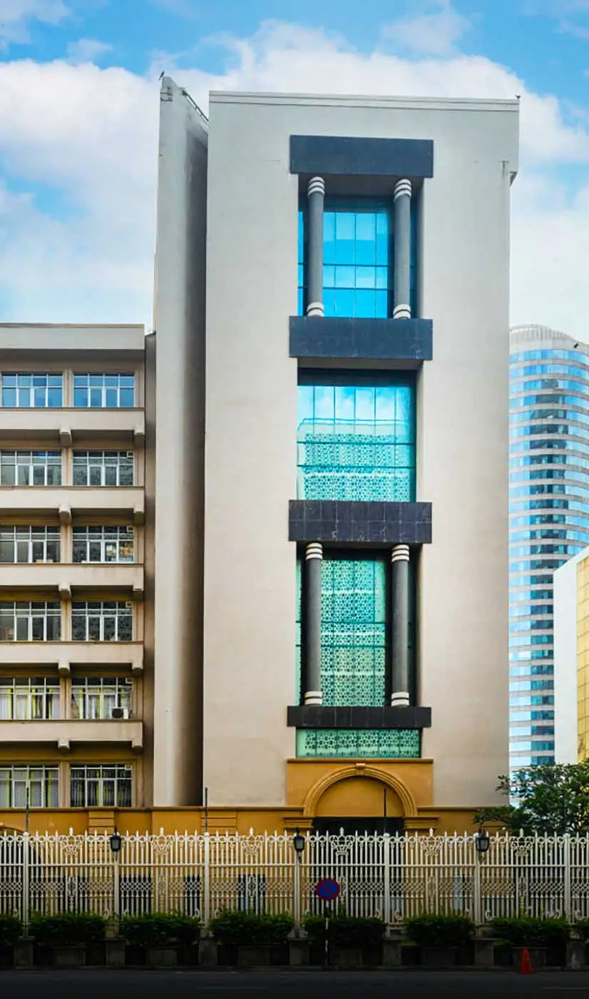 A hotel building with a prominent windows